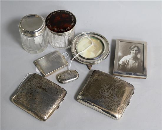 Two silver cigarette cases, an engine-turned match book holder and sundries,